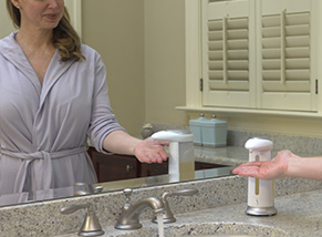 Image of a woman in a robe using Sonic Soap to get soap out